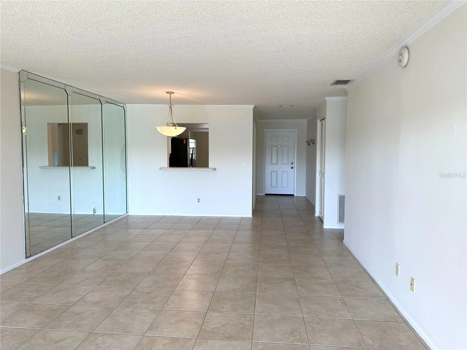 Living Room and dining room looking to front door
