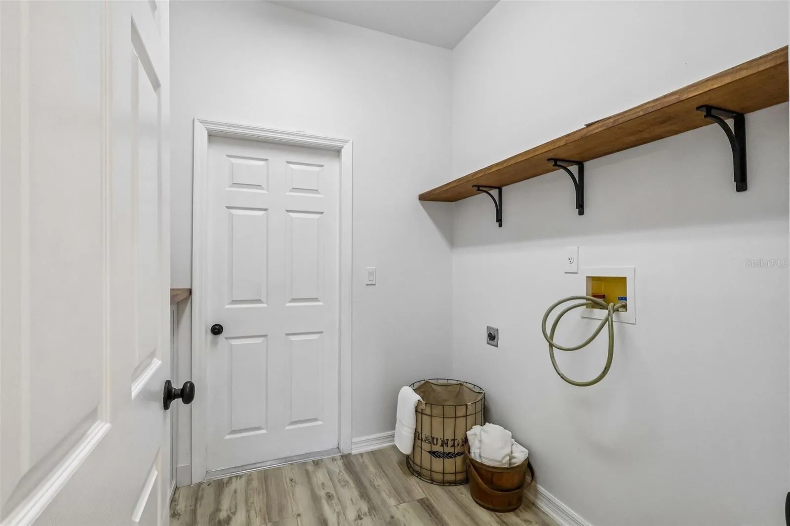 Downstairs laundry room with storage. Beautifully updated.