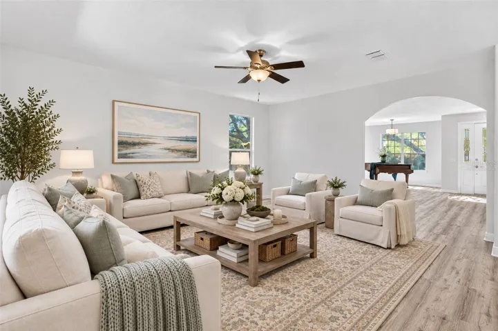 The family room facing the backyard and adjacent to the kitchen. Virtually staged to help you envision your future here.