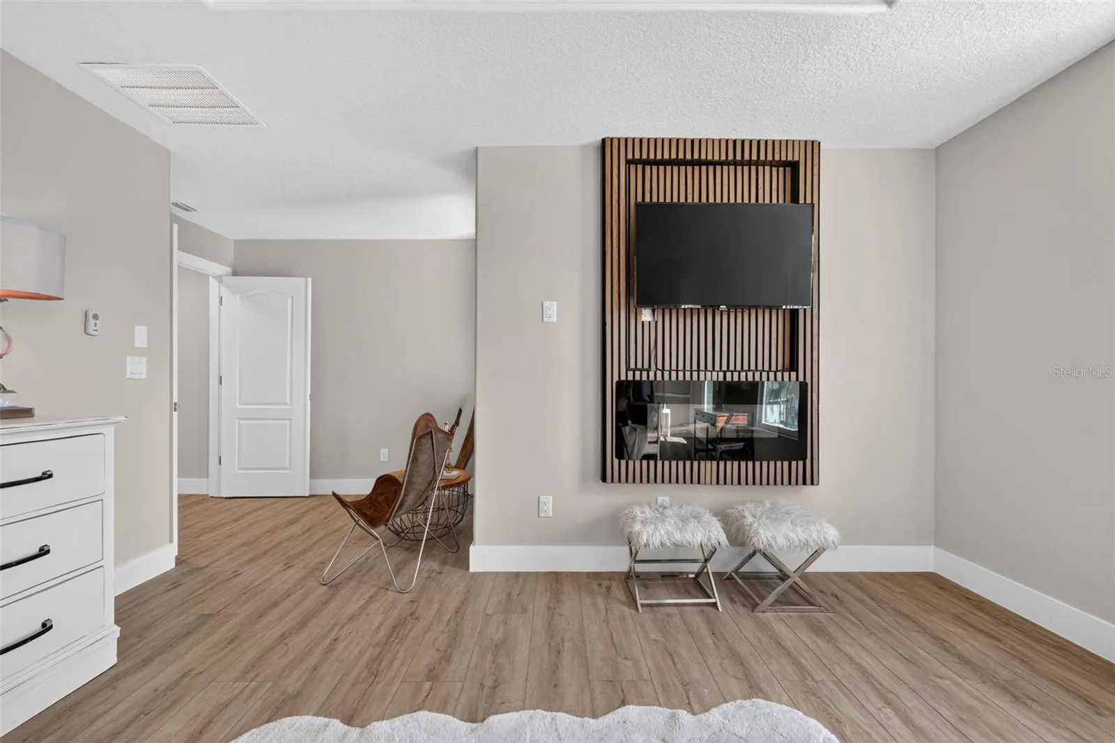 Primary bedroom electric fireplace