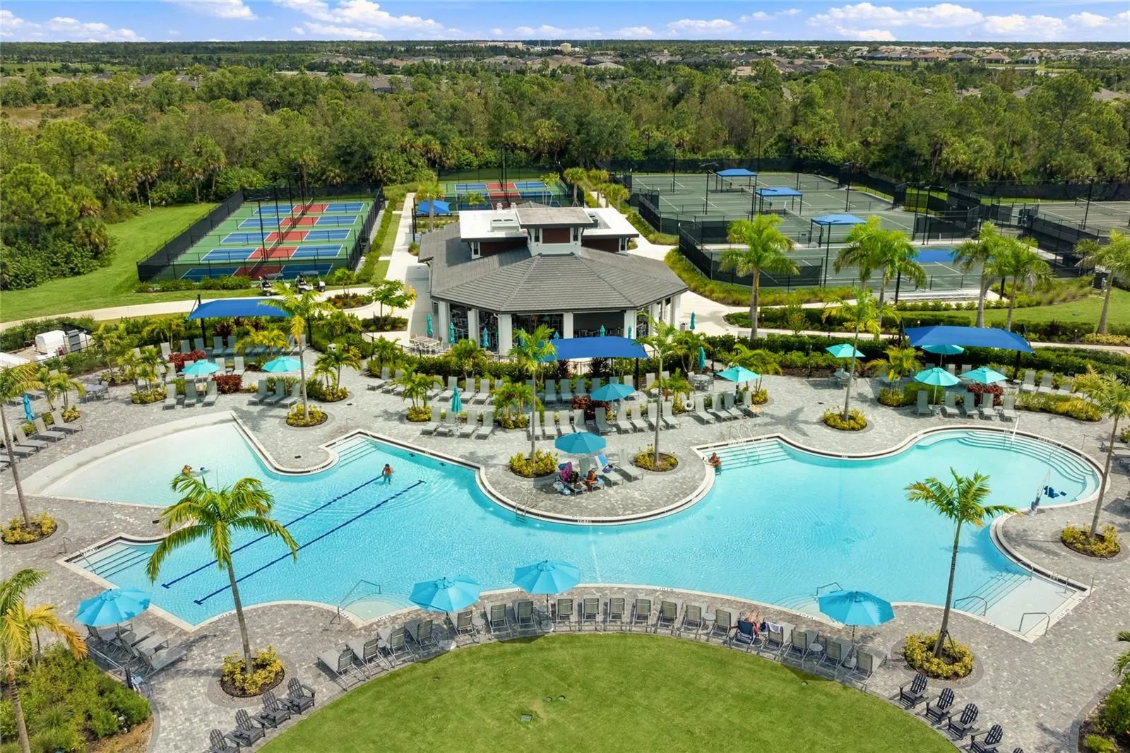 Welllen Park Golf and Country Club Resort Style Pool and Tiki Bar and Restaurant. Abundance of Pickleball and Tennis Courts at Wellen Park Golf and Country Club.