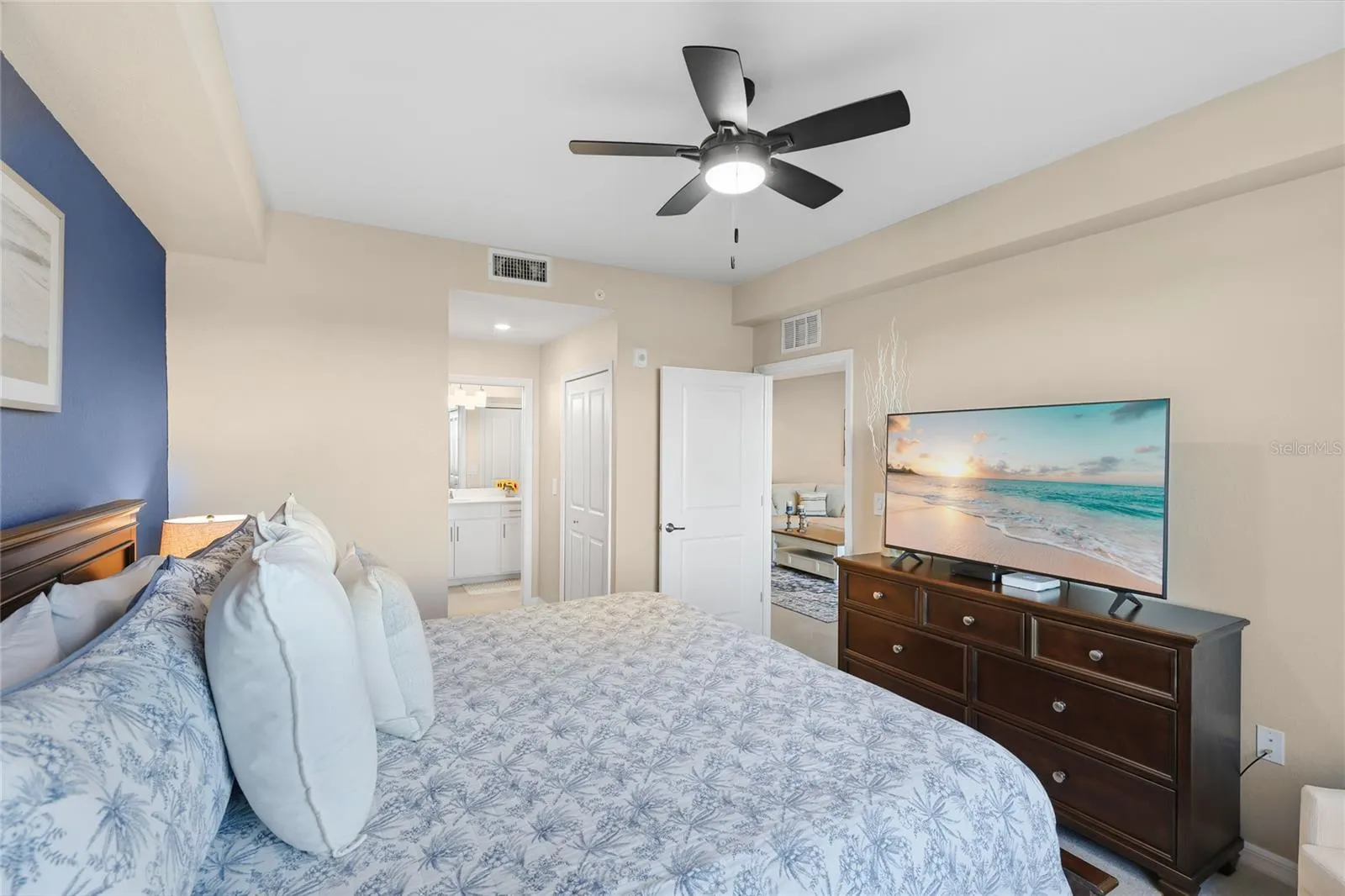 Spacious Owner's suite with ensuite bathroom and walk in closets overlooking the Golf Course, Water and preserve views