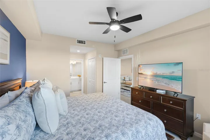 Spacious Owner's suite with ensuite bathroom and walk in closets overlooking the Golf Course, Water and preserve views