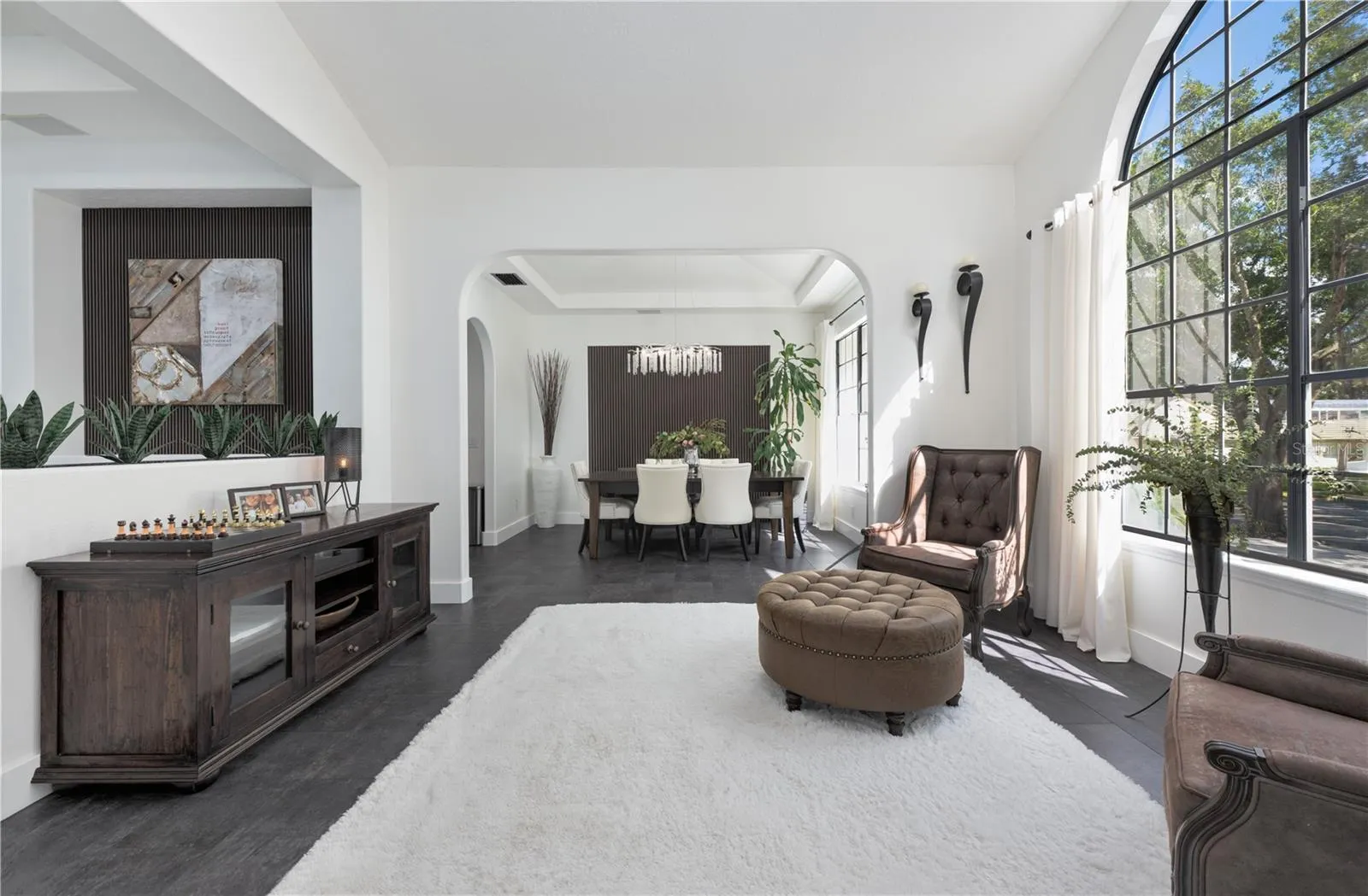 Natural light fills the formal living room and dining room.