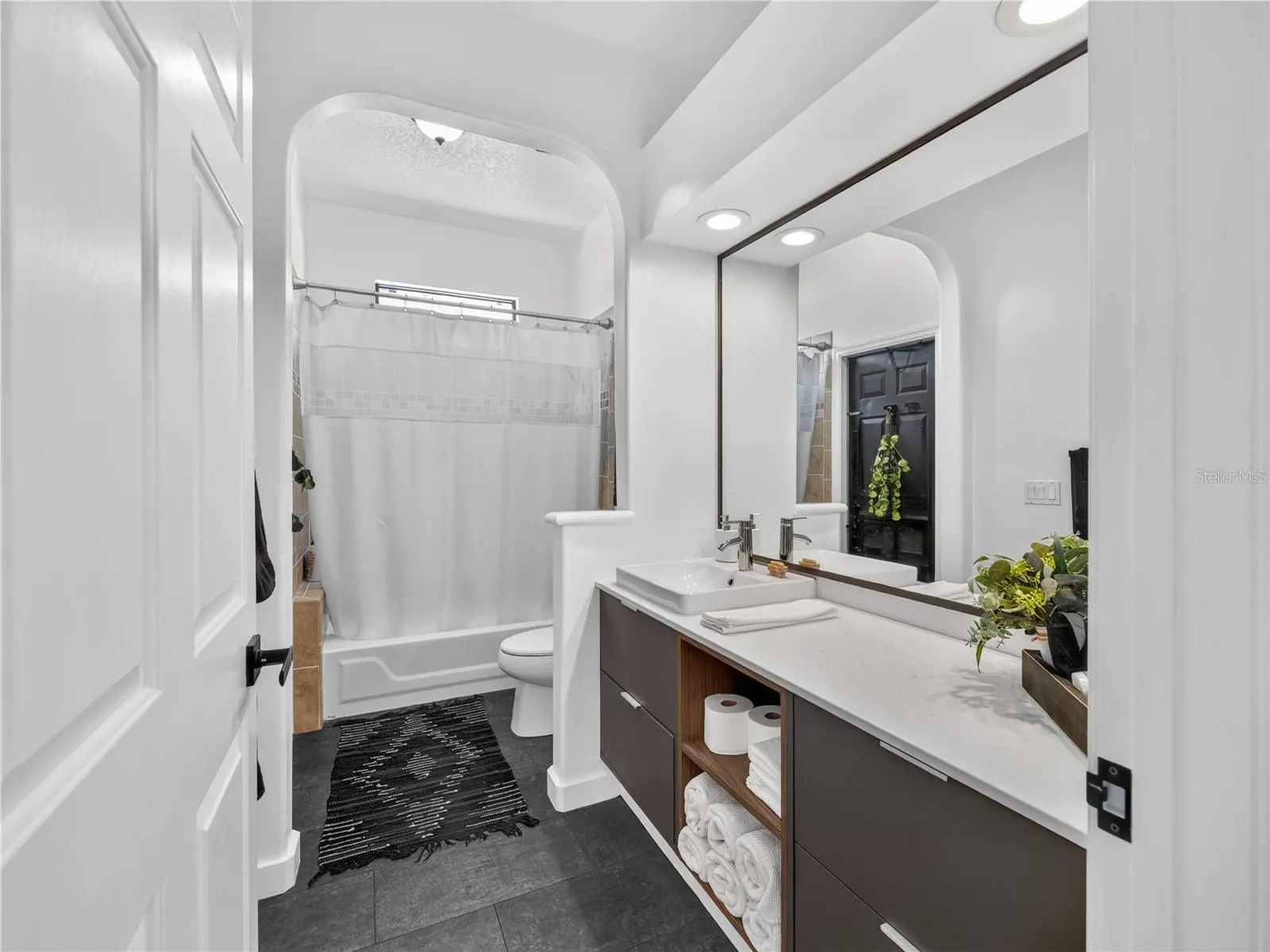 The third full bath is conveniently located near the second and third bedrooms.