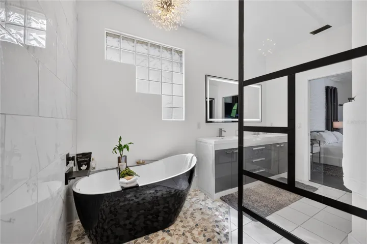 The star of the primary bathroom is a luxurious soaking tub.