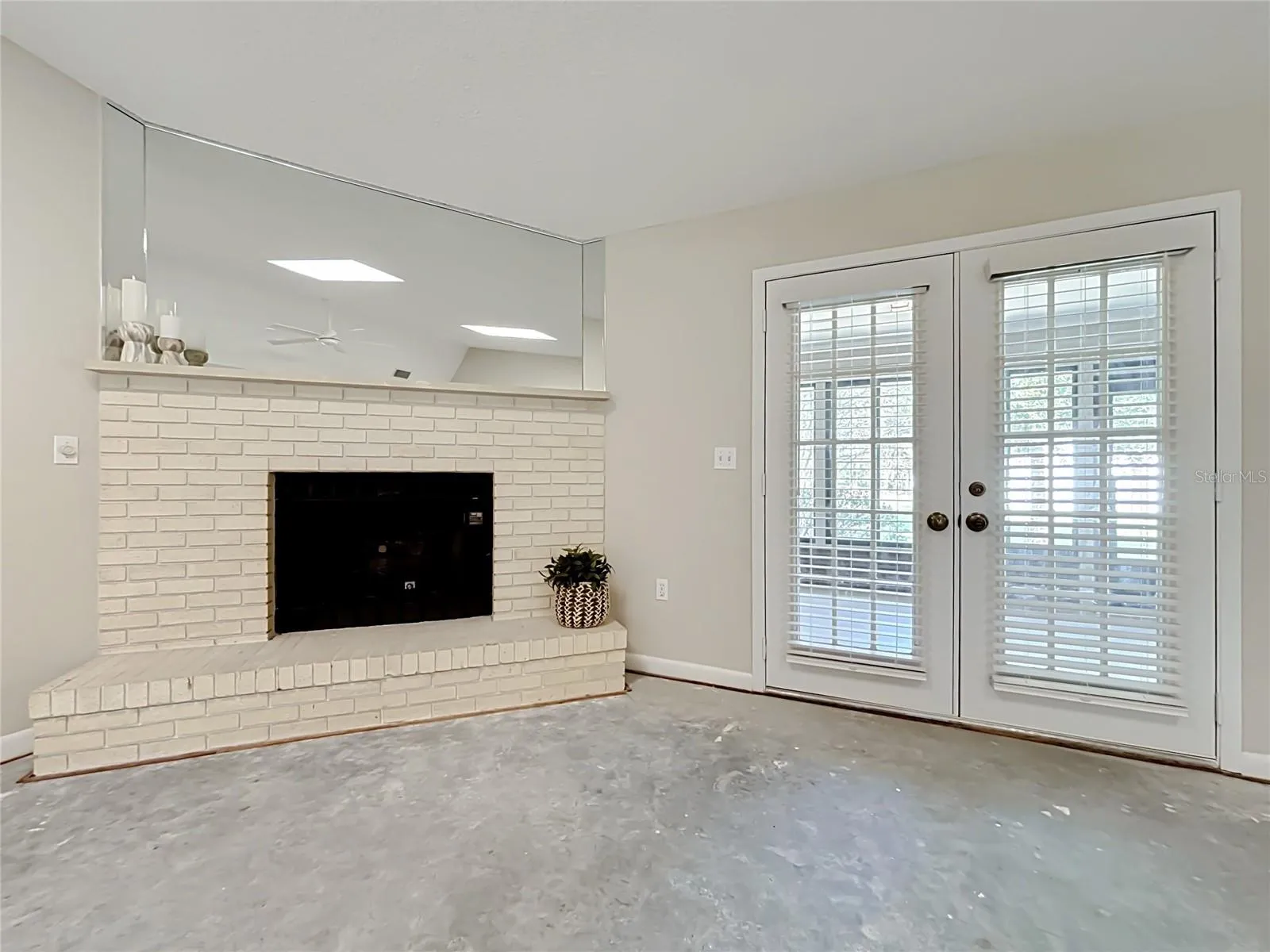 French doors open from great room to enormous Florida room