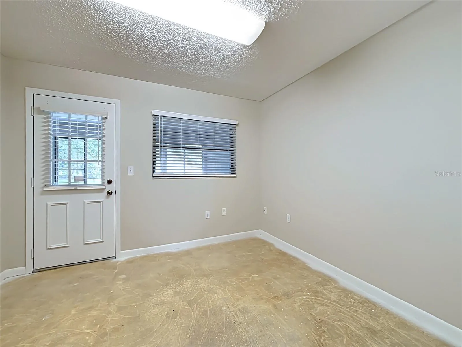 Bonus room/office/playroom has door opening to Florida room