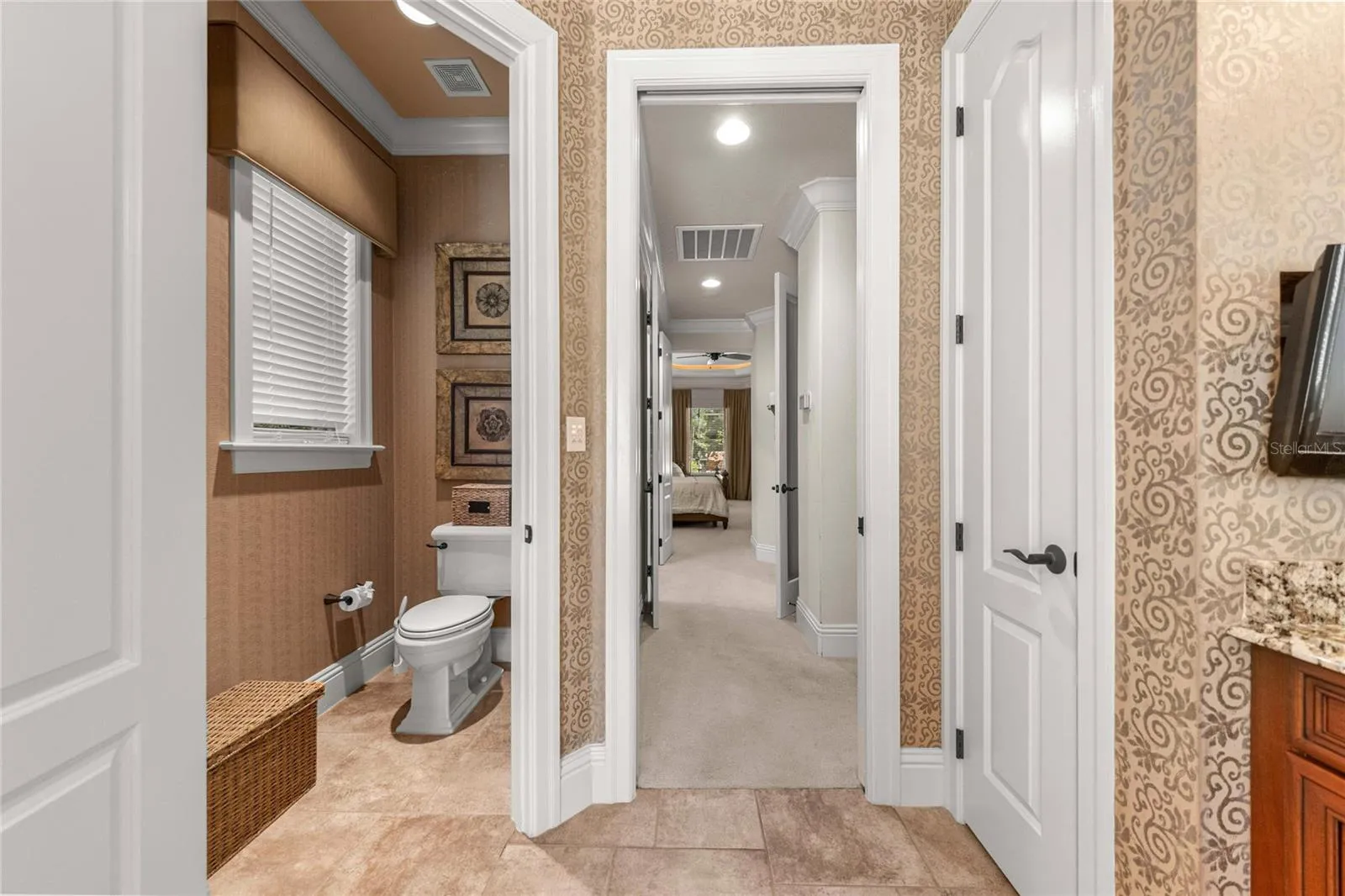 Thoughtfully designed owner's bathroom with separate water closet and convenient access to the primary suite.