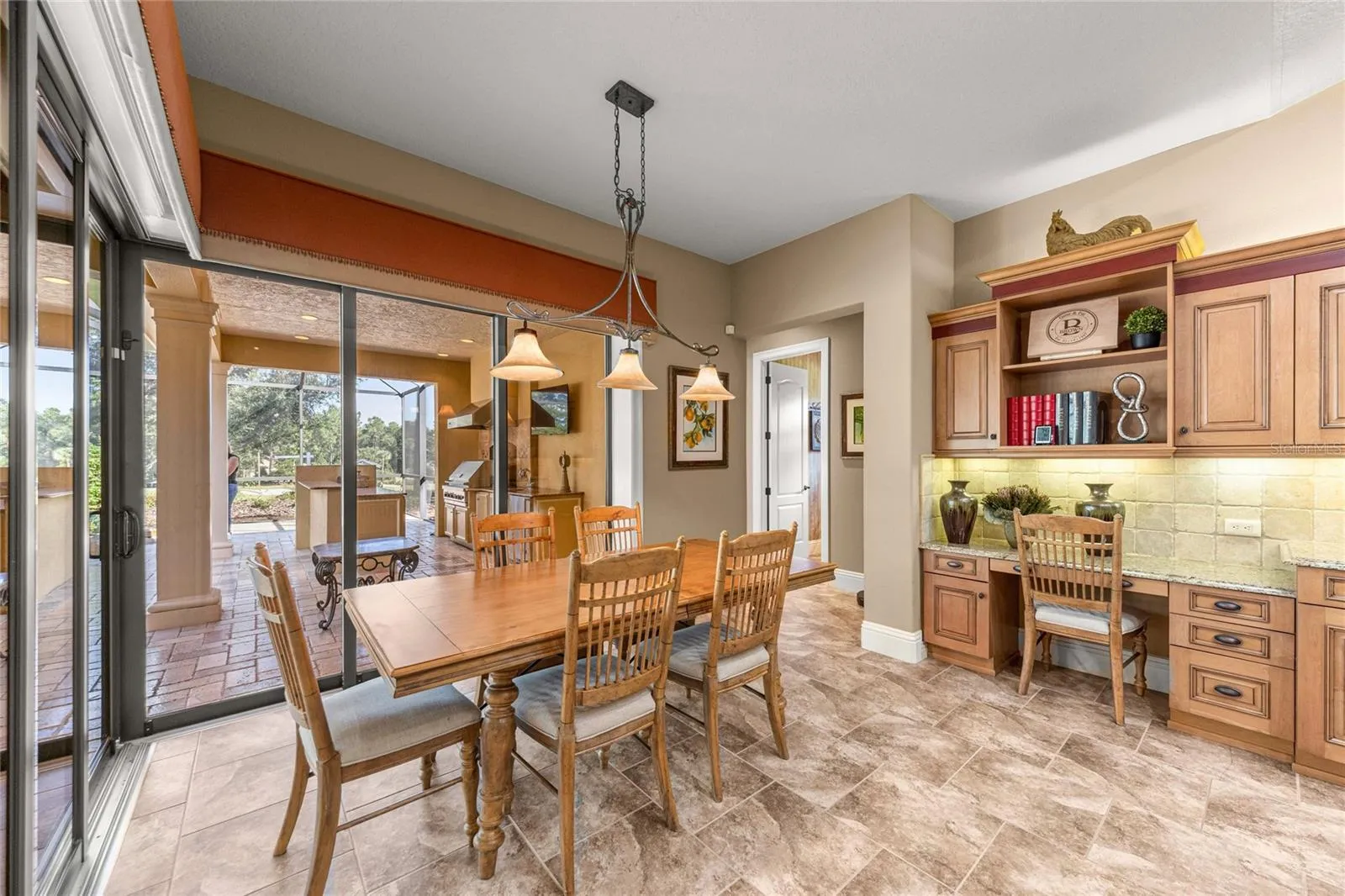 Bright dining area with corner sliding glass doors