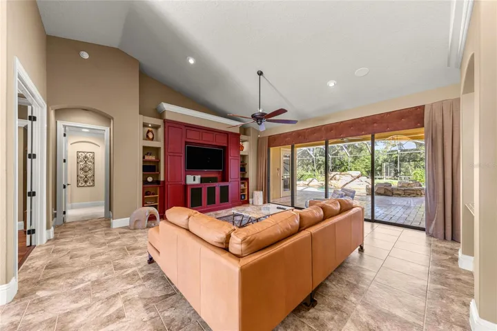 Open living space featuring custom entertainment wall.