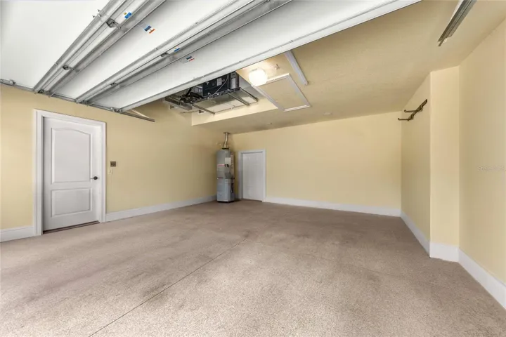 Garage – Spacious garage with finished walls and ample room for vehicles and storage.