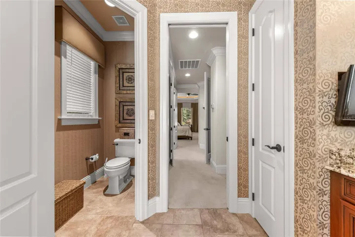 Thoughtfully designed owner's bathroom with separate water closet and convenient access to the primary suite.