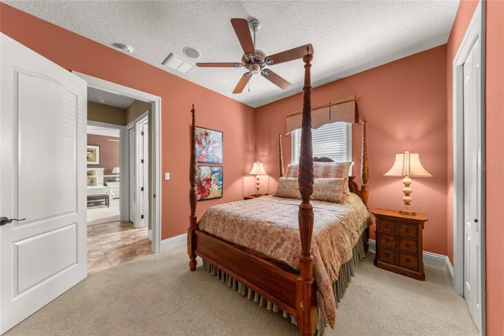 Additional view of the comfortable guest bedroom, showcasing its spacious layout, natural lighting, and convenient closet.