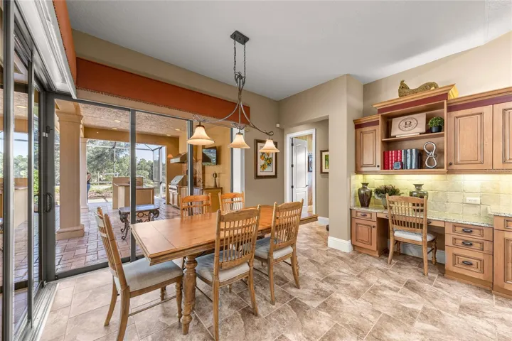 Bright dining area with corner sliding glass doors