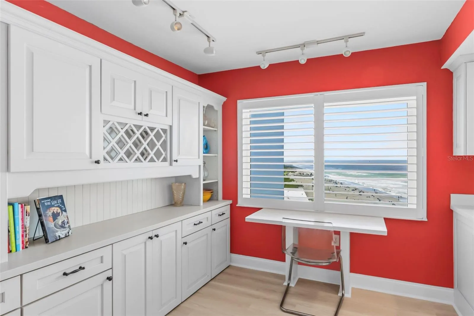The large kitchen includes abundant cabinet space and a built-in desk.  A small in-kitchen dining set could also be added.
