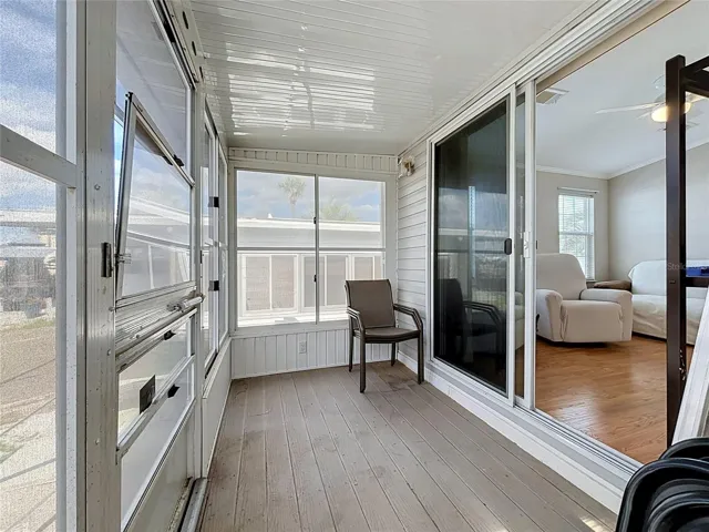 Screened in porch with vinyl windows provides wonderful views of the canal