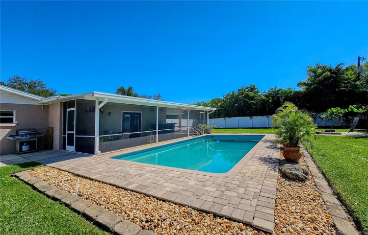 Brick Paver patio around freshwater 15 ' x 30' pool