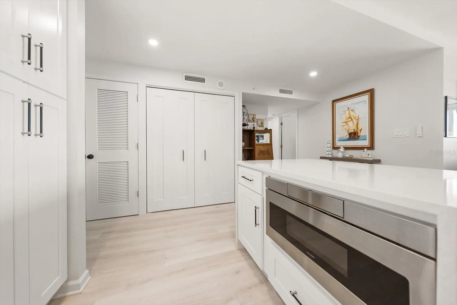 Built in microwave in kitchen island to efficiently free up cabinet &amp; counter space.