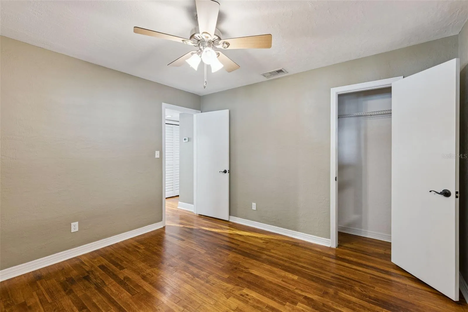 Secondary bedroom with walk in closet