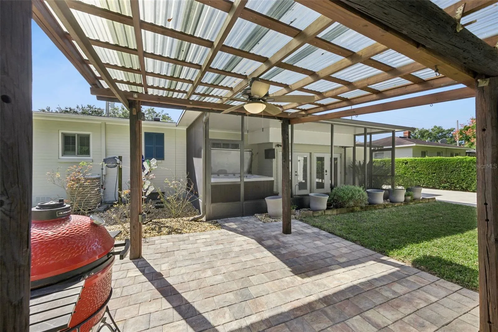 Sturdy Gazebo for all your grills!  Ceiling fan and power on a pole complete this area for your outdoor grilling needs