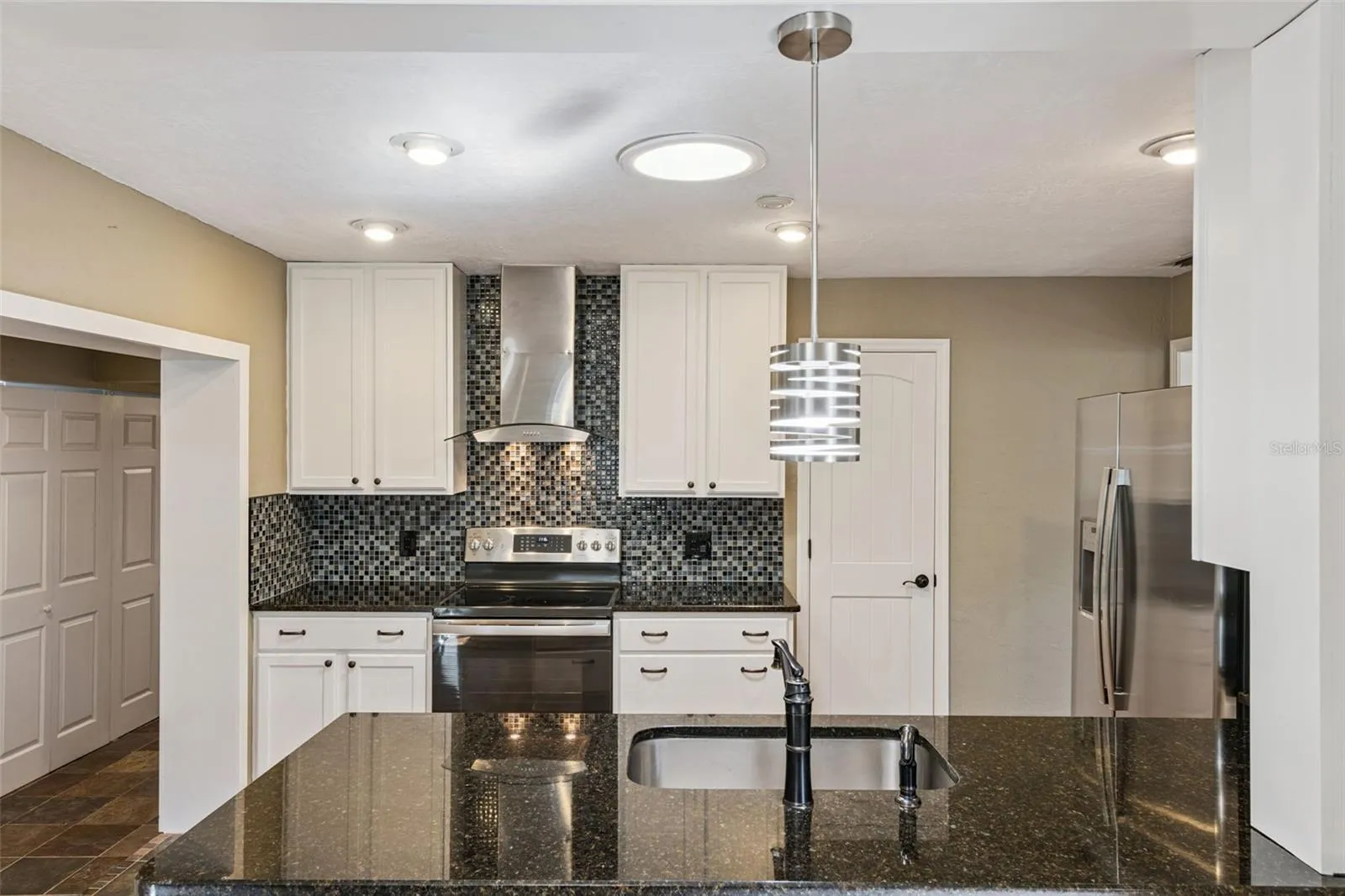 Modern updated kitchen with range hood