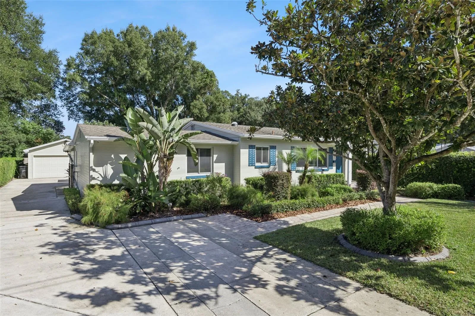 Downtown with a extra long driveway to a 4 car tandem garage.