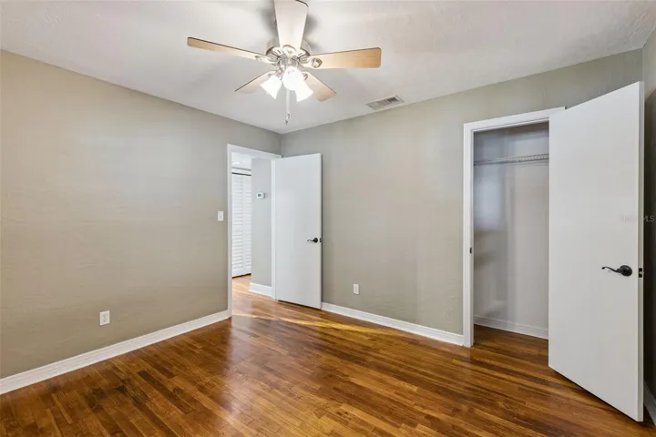 Secondary bedroom with walk in closet