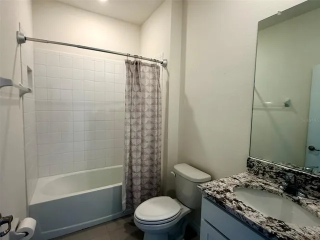 Full bath with tub and toals closet