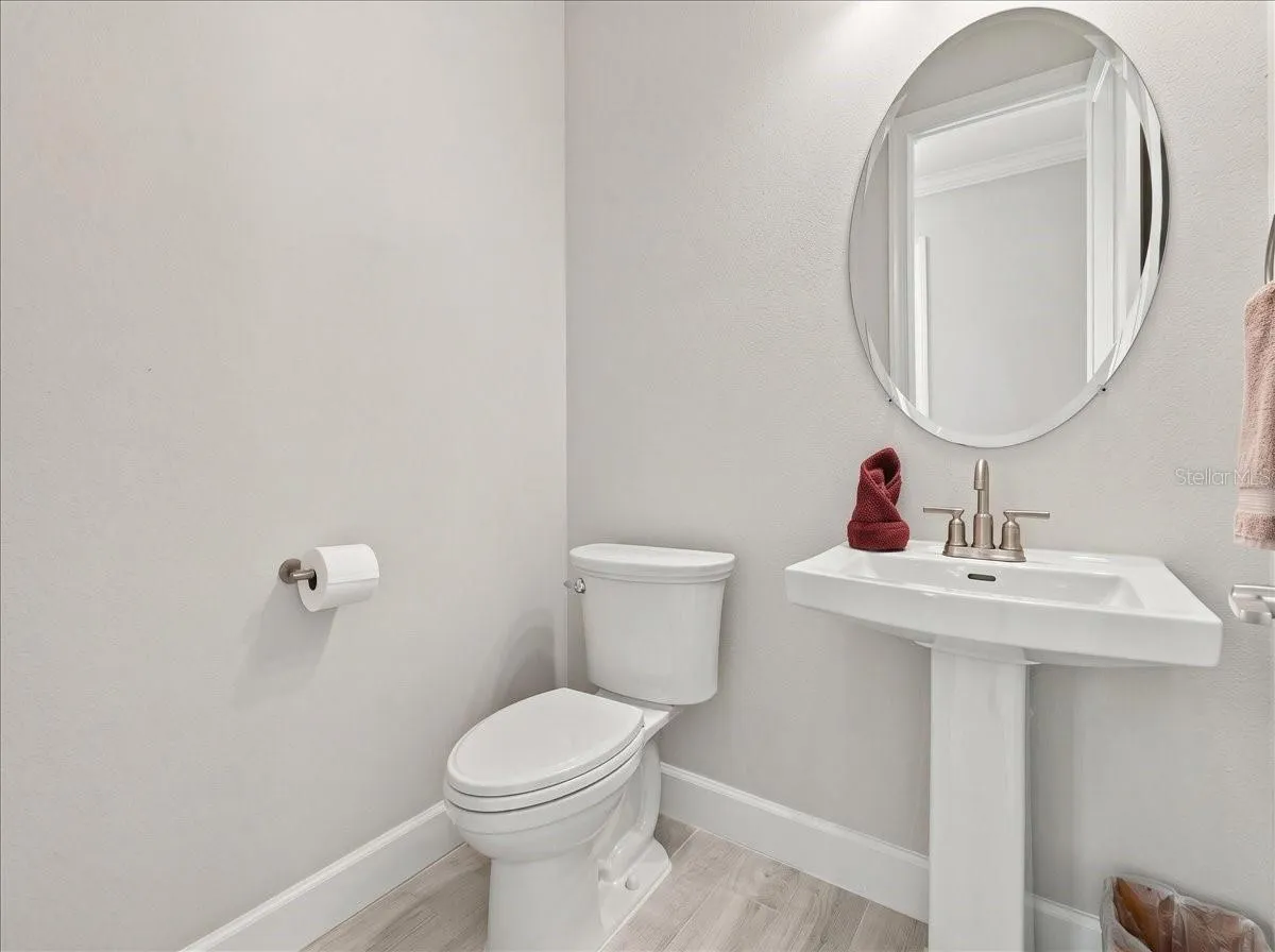 The half bath is conveniently located right inside the front of the home for guests.