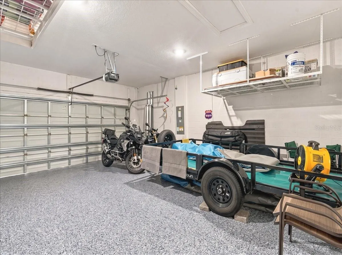 The garage has an epoxy finish along with overhead storage.