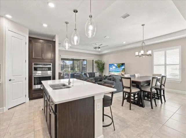 There is tile throughout the home and carpet in all 3 bedrooms .