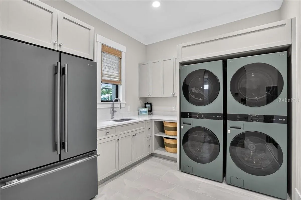 Dual double stack Washer and Dryer.  Color matched refrigerator.