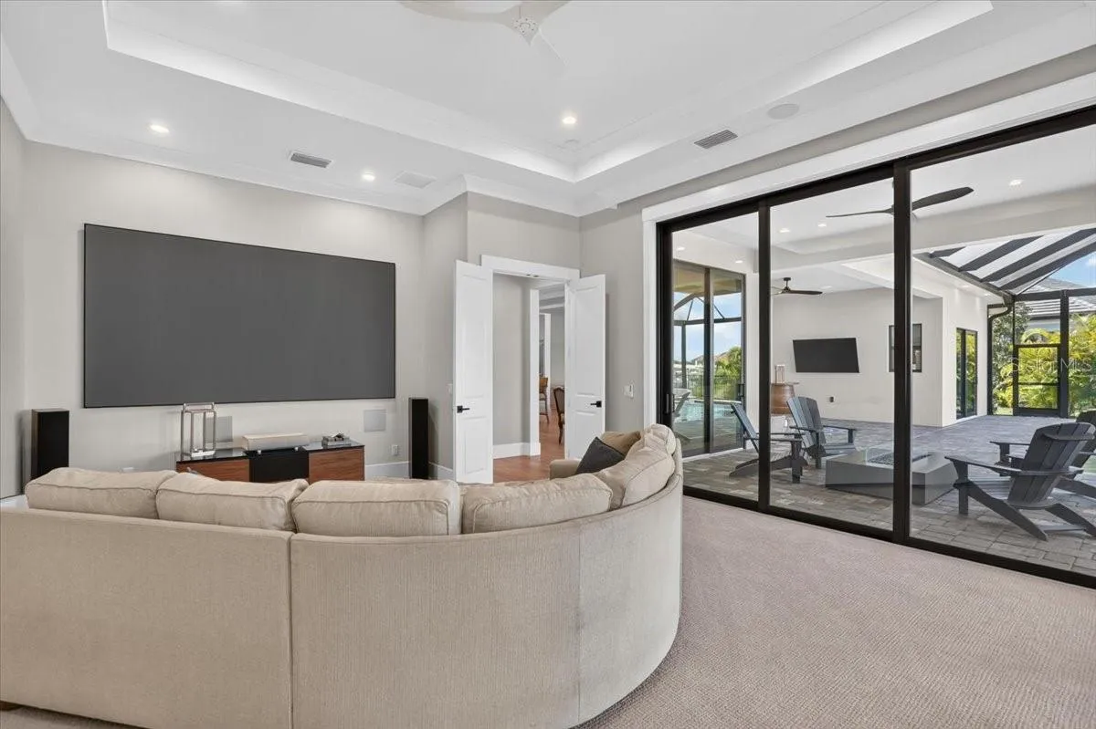 140" screen, short throw projector, two in-wall subs, immersive theater quality audio