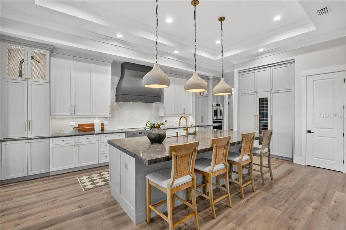 Custom Tile Backsplash, Walk-in Pantry with electric outlets.