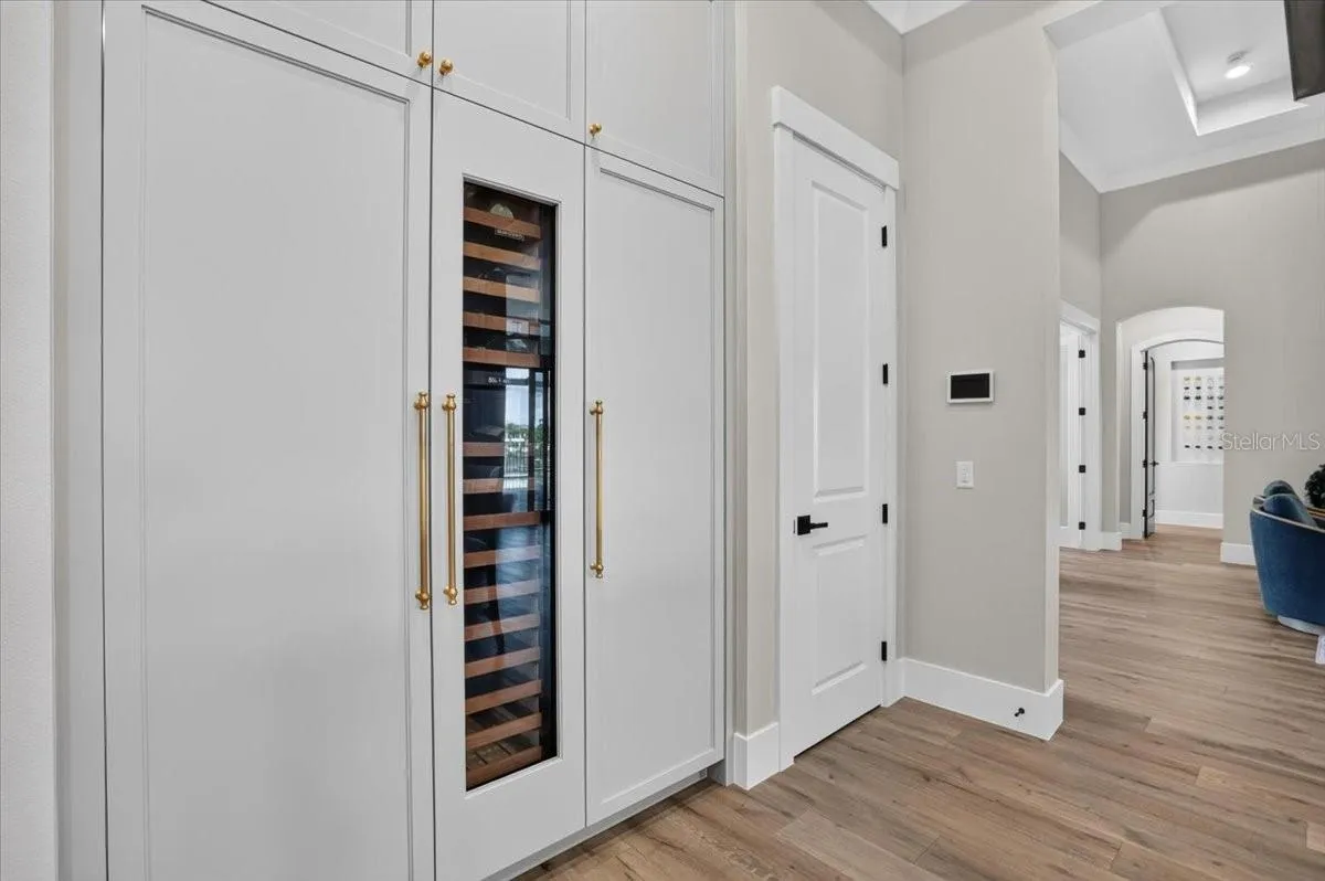 Sub Zero Freezer (left) Wine Fridge (center) Refrigerator (right)