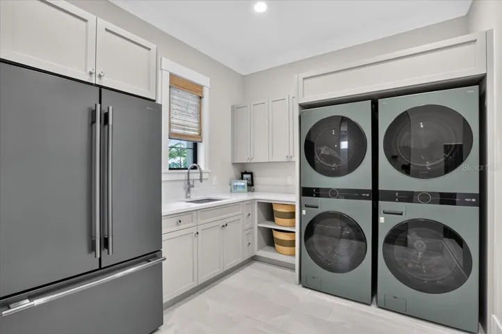 Dual double stack Washer and Dryer.  Color matched refrigerator.