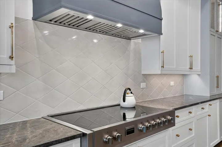 7-burner, 48" Fulgor Milano induction range and custom wood hood