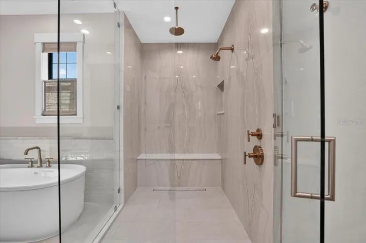 Oversized Walk-in Shower with Dual shower heads.