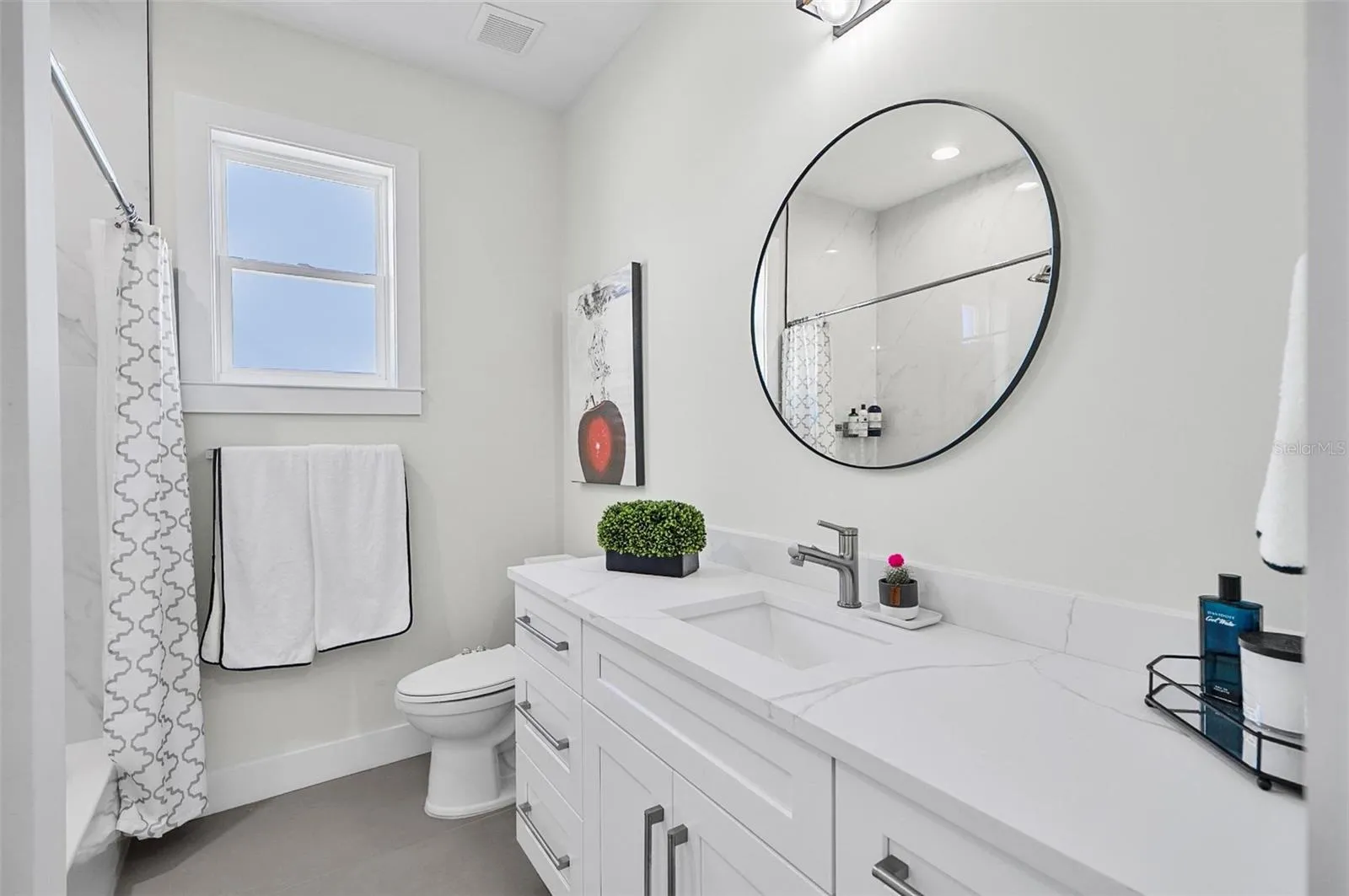 HALLWAY BATH WITH A TUB AND SHOWER COMBINATION