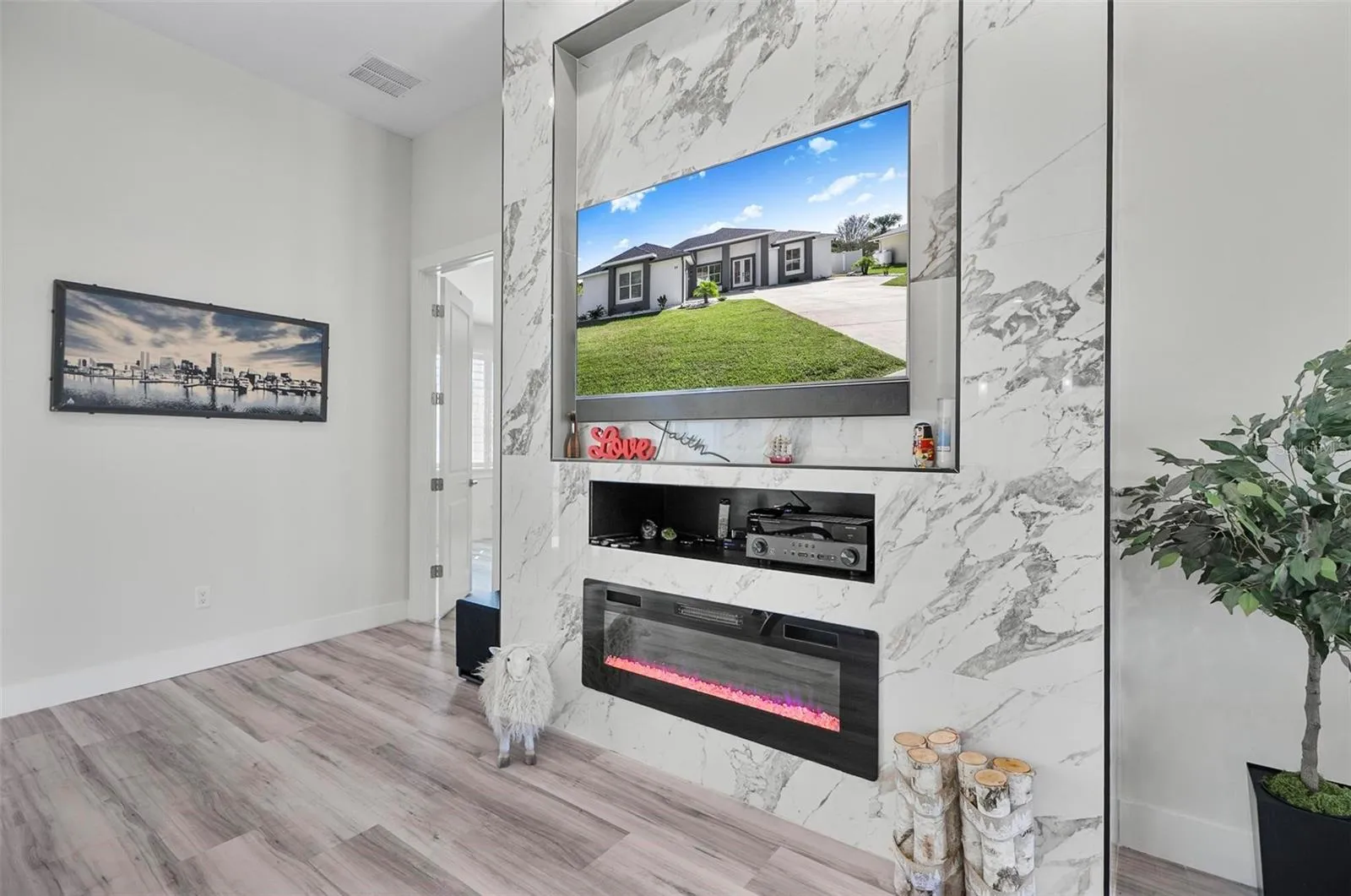 FIREPLACE IS THE FOCAL FEATURE IN THE MASSIVE LIVING SPACE