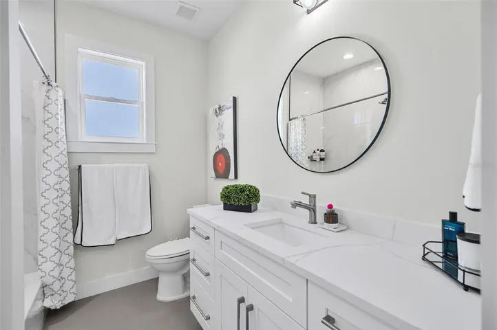 HALLWAY BATH WITH A TUB AND SHOWER COMBINATION