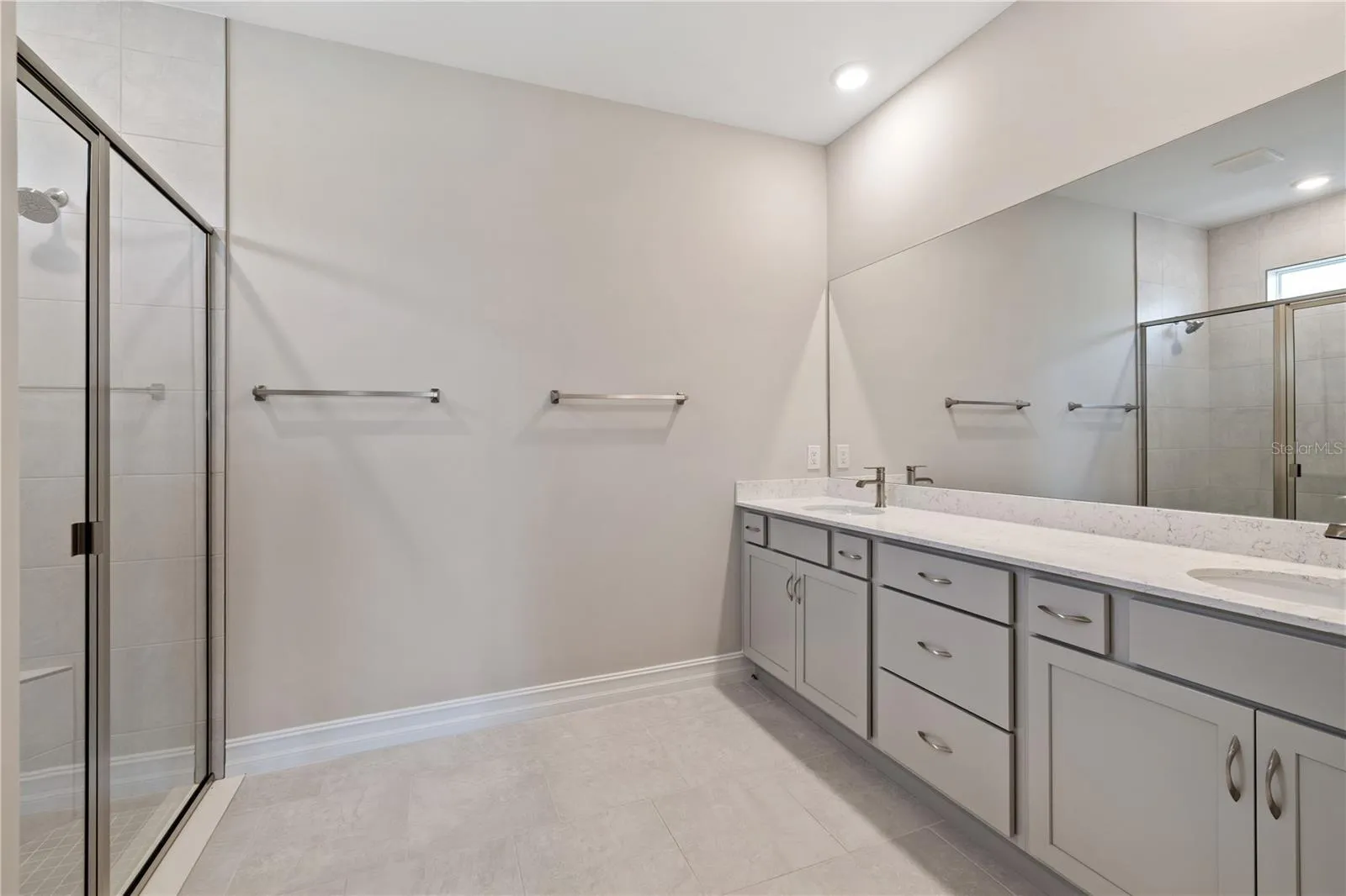 Primary bathroom with two sinks.