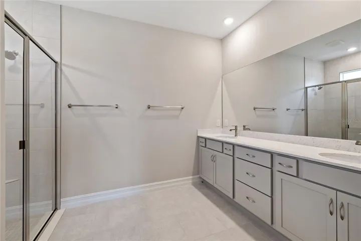 Primary bathroom with two sinks.