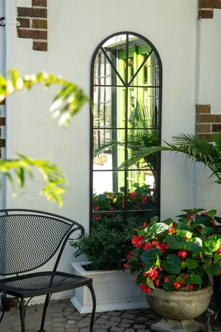 Left side of main entrance to home.