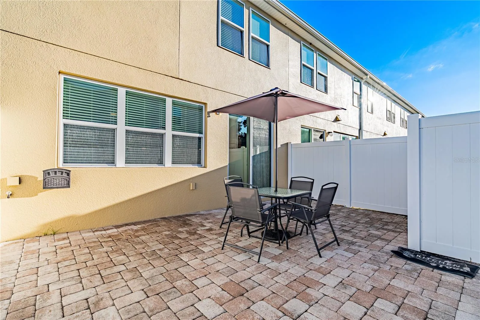 Add twinkling lights, a touch of greenery, and transform this charming lanai into your own private outdoor oasis!