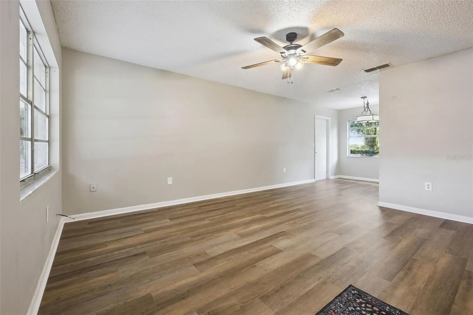 Living Room flows to Kitchen Dining.