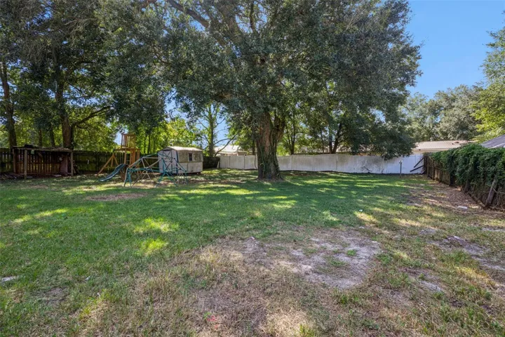 Drive gate leads to back yard - so many possibilities here!