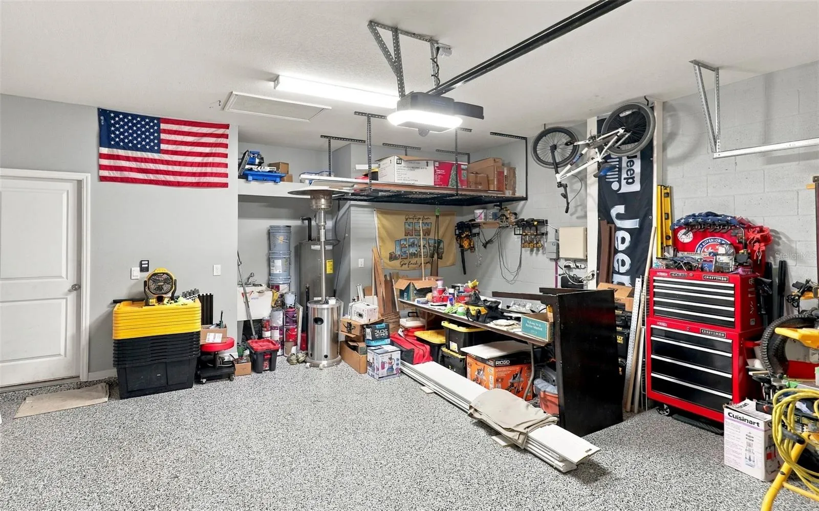 Garage Showcasing Epoxy-Coated Flooring and Ample Storage Space
