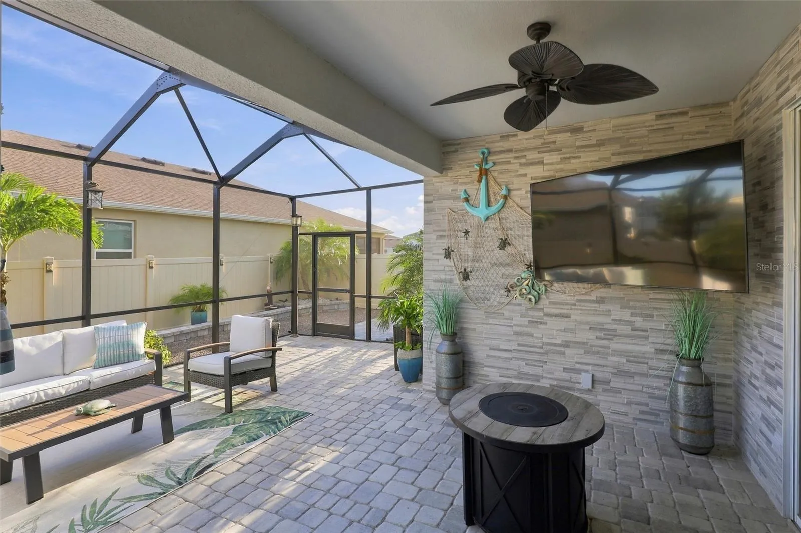 Covered Lanai with Ceiling Fan and Spacious Seating Area